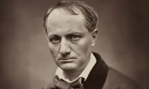 Portrait en sépia d'un homme au regard intense, sa chevelure baudelaire légèrement dégarnie encadrant un visage pensif.