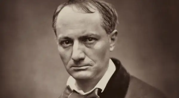 Portrait en sépia d'un homme au regard intense, sa chevelure baudelaire légèrement dégarnie encadrant un visage pensif.