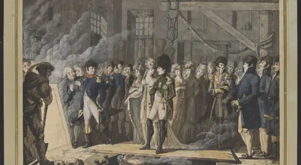 Napoléon, entouré de sa cour, examine un plan dans son cabinet de travail. L'ambiance est solennelle.