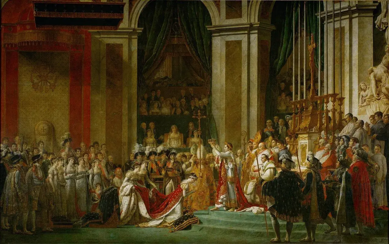 Le couronnement de Napoléon Ier, le 5 mai 1804, dans la cathédrale Notre-Dame de Paris. Une scène grandiose avec l'empereur et l'impératrice entourés de dignitaires.