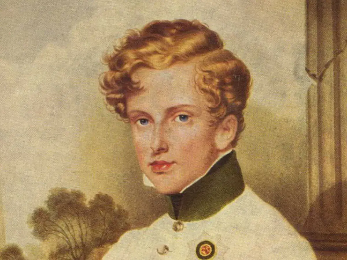 Portrait du jeune Napoléon II, roi de Rome, aux cheveux blonds bouclés et aux yeux bleus, portant un uniforme militaire.
